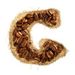 Alphabet from coffee beans on fabric texture isolated on white