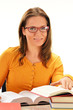 Young woman reading a book. Female student learning
