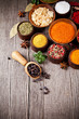 Various kind of spices in wooden bowls