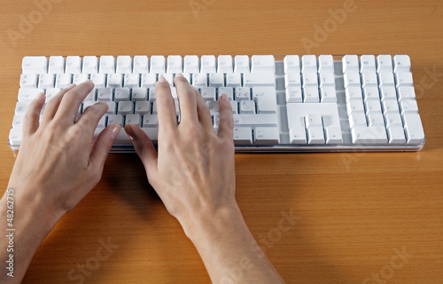 Photo: woman hands typing on a keyboard computer woman hands typing on a keyboard computer