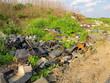 Garbage dump on green meadow Garbage dump on green meadow