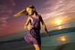 Photo: Girl jumping and dancing on beautiful beach. Girl jumping and dancing on beautiful beach.