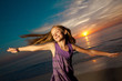 Photo: Girl jumping and dancing on beautiful beach. Girl jumping and dancing on beautiful beach.