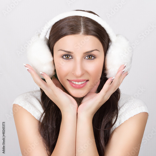 Photo: Fashionable young woman in white winter clothes Fashionable young woman in white winter clothes