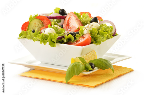 Photo: Vegetable salad bowl isolated on white Vegetable salad bowl isolated on white