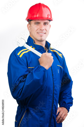 Photo: Portrait of young handsome mechanic with hard hat Portrait of young handsome mechanic with hard hat