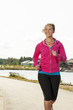 Happy woman jogger training in the park. Healthy lifestyle and p