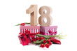 Photo: Age in figures in a party mood on a bed of red tulips Age in figures in a party mood on a bed of red tulips