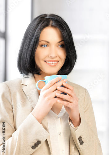 Photo: lovely businesswoman with mug lovely businesswoman with mug