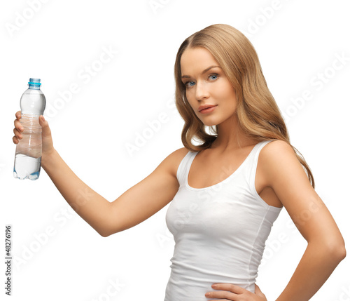 Photo: young beautiful woman with bottle of water young beautiful woman with bottle of water