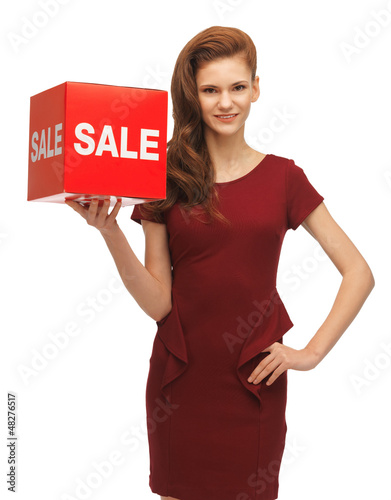 Photo: teenage girl in red dress with sale sign teenage girl in red dress with sale sign