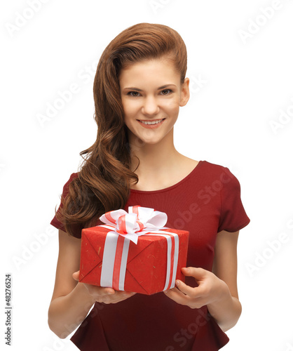 Photo: teenage girl in red dress with gift box teenage girl in red dress with gift box