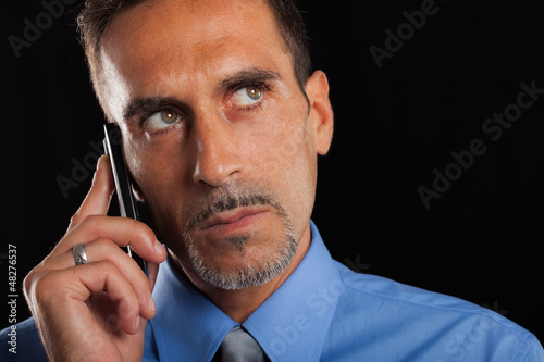 Photo: Businessman talking on the phone Businessman talking on the phone