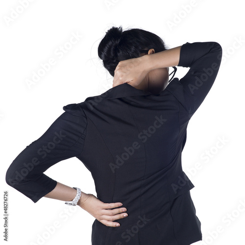 Photo: Business woman with back pain isolated white background Business woman with back pain isolated white background