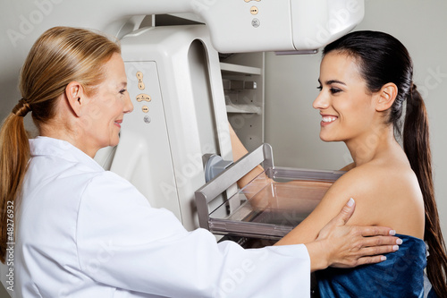Photo: Doctor With Patient Getting Mammogram X-ray Test Doctor With Patient Getting Mammogram X-ray Test