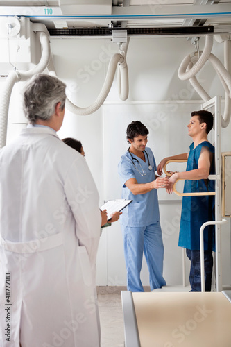 Photo: Medical Team With Patient In X-ray Room Medical Team With Patient In X-ray Room