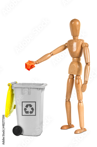 Photo: wooden dummy putting paper in container wooden dummy putting paper in container