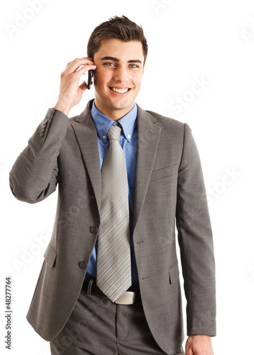 Photo: Businessman talking on the phone. Isolated on white Businessman talking on the phone. Isolated on white