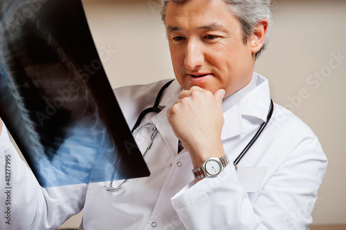 Photo: Radiologist Studying X-ray Radiologist Studying X-ray