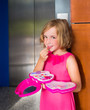 child kid girl playing with makeup lipstick in the lift door