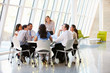 Photo: Business People Having Board Meeting In Modern Office Business People Having Board Meeting In Modern Office
