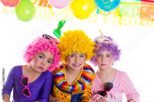 Photo: Children happy birthday party with clown wigs Children happy birthday party with clown wigs