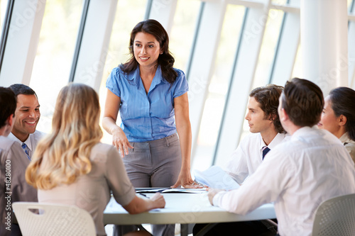 Photo: Business People Having Board Meeting In Modern Office Business People Having Board Meeting In Modern Office