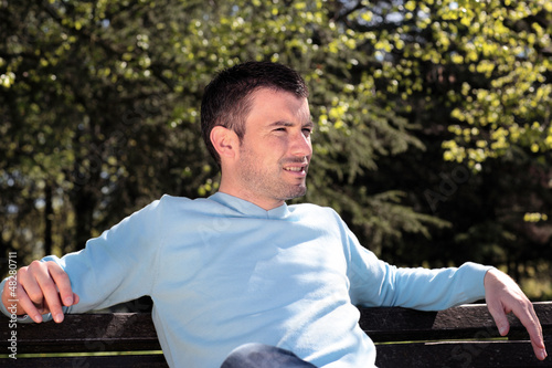 Photo: handsome man in a park handsome man in a park