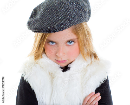 Photo: angry gesture child sad blond kid girl portrait winter cap angry gesture child sad blond kid girl portrait winter cap