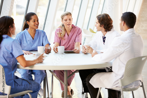 Photo: Medical Staff Chatting In Modern Hospital Canteen Medical Staff Chatting In Modern Hospital Canteen