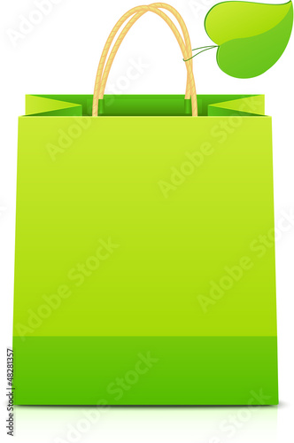 Vector: Green paper shopping bag with paper leaf on handle Green paper shopping bag with paper leaf on handle