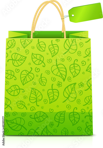 Vector: Green paper shopping bag with floral ornament and green label Green paper shopping bag with floral ornament and green label