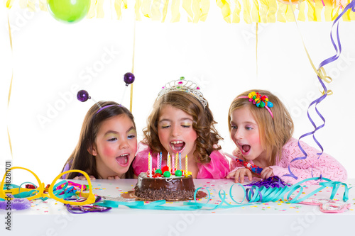 Photo: children kid girls birthday party look excited chocolate cake children kid girls birthday party look excited chocolate cake