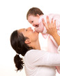 Baby girl hug in mother arms playingin happy on white
