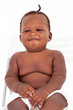 smiling cute african american baby boy sitting on a chair