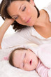 Baby girl sleeping with mother care near