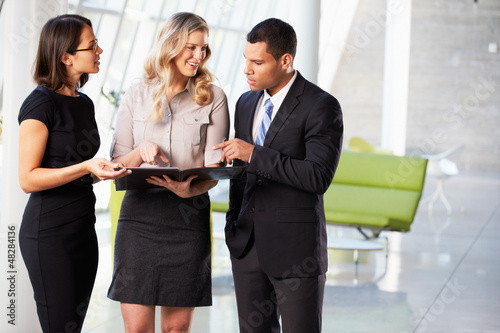Photo: Businesspeople Having Informal Meeting In Modern Office Businesspeople Having Informal Meeting In Modern Office