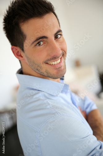 Photo: Portrait of handsome young man with blue shirt Portrait of handsome young man with blue shirt
