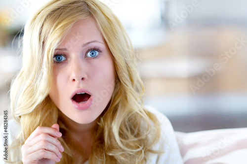 Photo: Blond woman with surprised look on her face Blond woman with surprised look on her face
