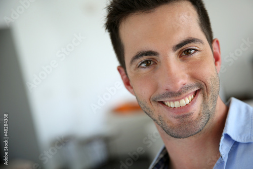 Photo: Portrait of handsome young man with blue shirt Portrait of handsome young man with blue shirt