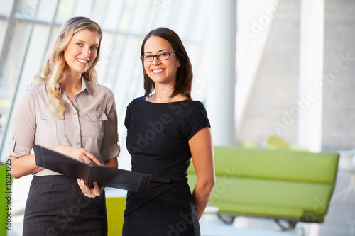 Photo: Businesswomen Having Informal Meeting In Modern Office Businesswomen Having Informal Meeting In Modern Office