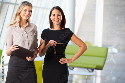 Photo: Businesswomen Having Informal Meeting In Modern Office Businesswomen Having Informal Meeting In Modern Office