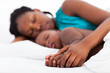 Photo: loving african mother napping with baby boy loving african mother napping with baby boy