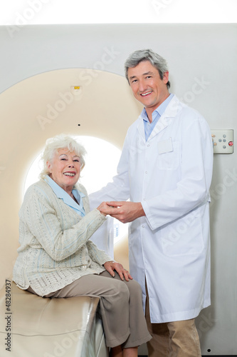 Photo: Happy Doctor And Female Patient Happy Doctor And Female Patient