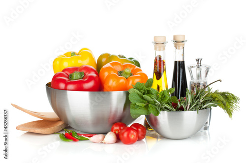 Photo: Fresh bell peppers and herbs in bowls Fresh bell peppers and herbs in bowls
