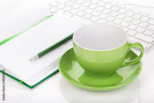 Photo: Coffee cup and office supplies Coffee cup and office supplies