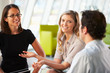Businesspeople Having Meeting Around Table In Modern Office