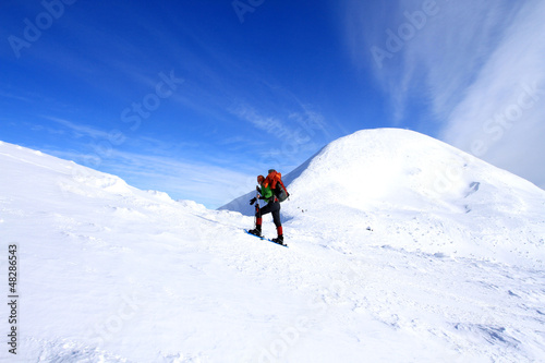 Photo: Winter hiking in snowshoes. Winter hiking in snowshoes.