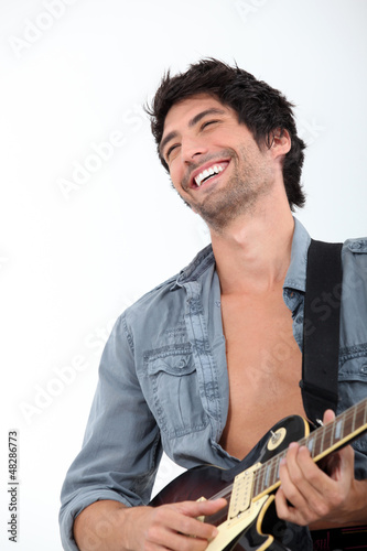 Photo: bust shot of man with bass bust shot of man with bass