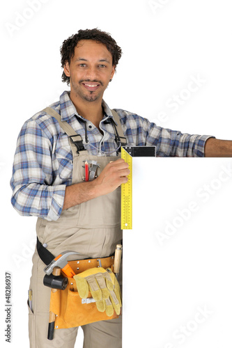 Photo: Carpenter stood by blank panel Carpenter stood by blank panel